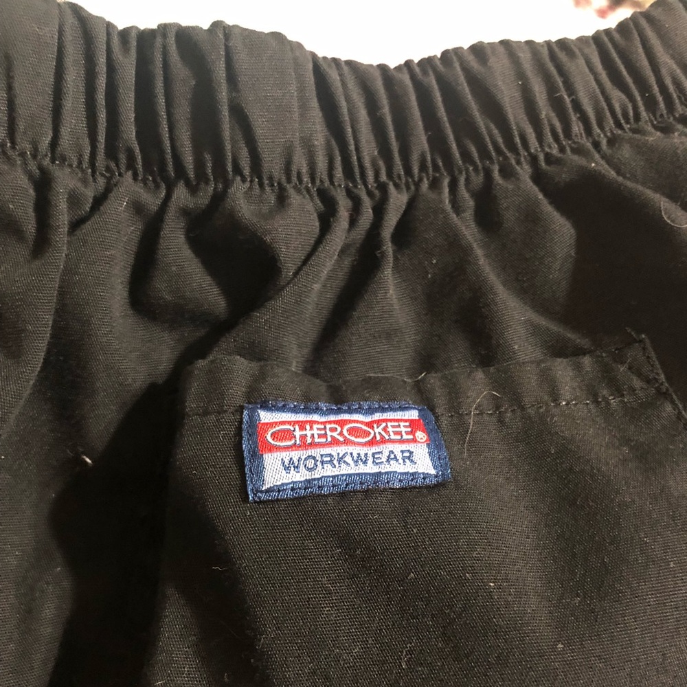 2 pair of Sz 3x scrub pants, one Cherokee and one unknown brand.